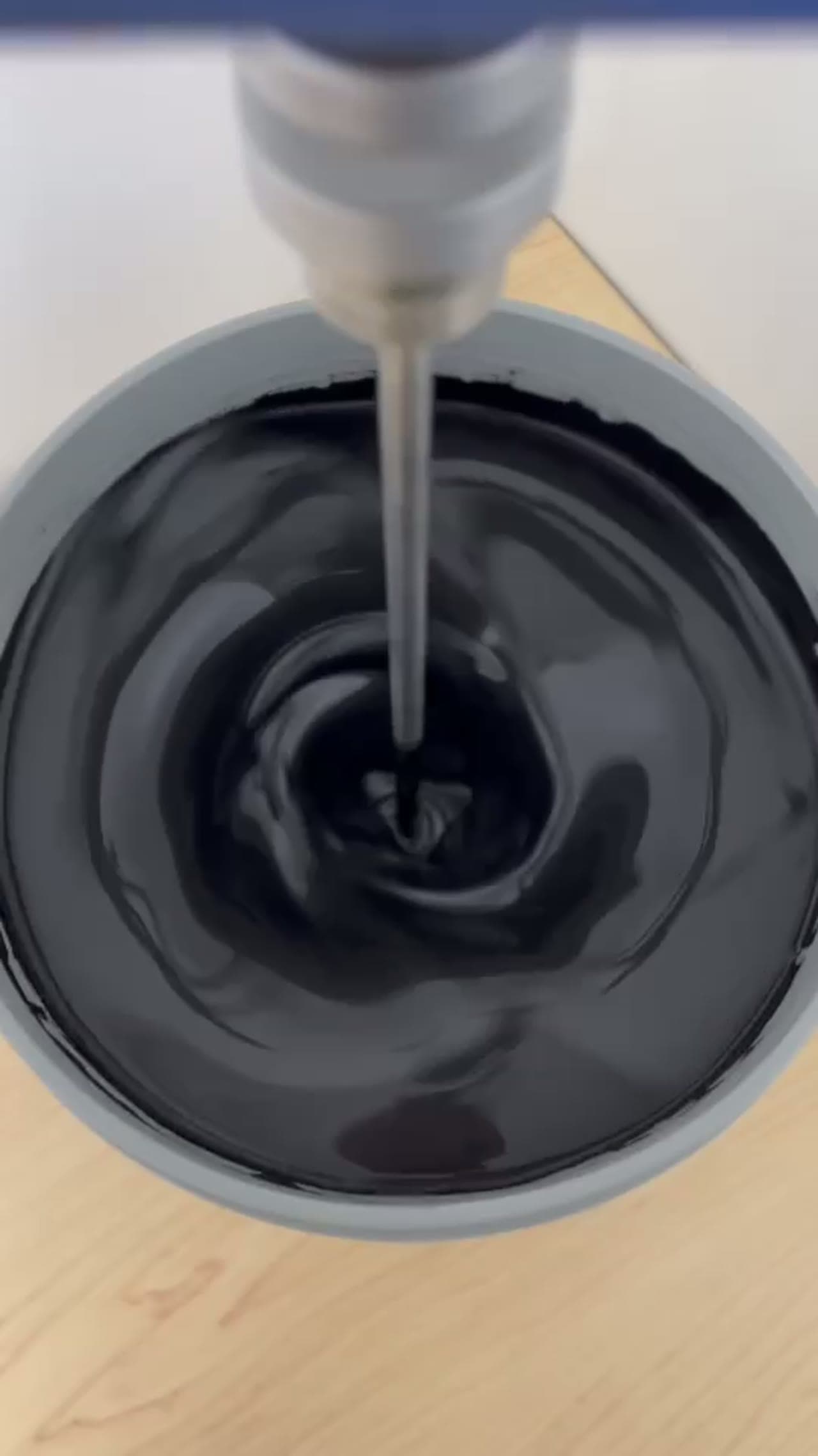 Black ΔC liquid biochar admixture being mixed in a bucket